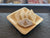 Badam Katli from Gupta's - the finest Indian Sweets, Savouries, Mithai, Confectionery and more. Order online now. Blanched almonds are ground and cooked in steaming sugar syrup and then rolled into a thin pastry and hand cut to a traditional diamond shape.